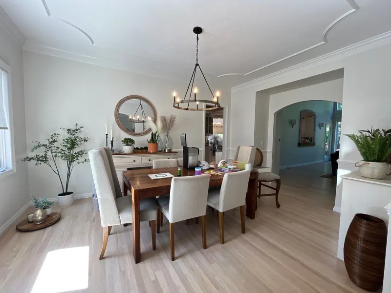 Freshly painted soft gray dining room with white trim